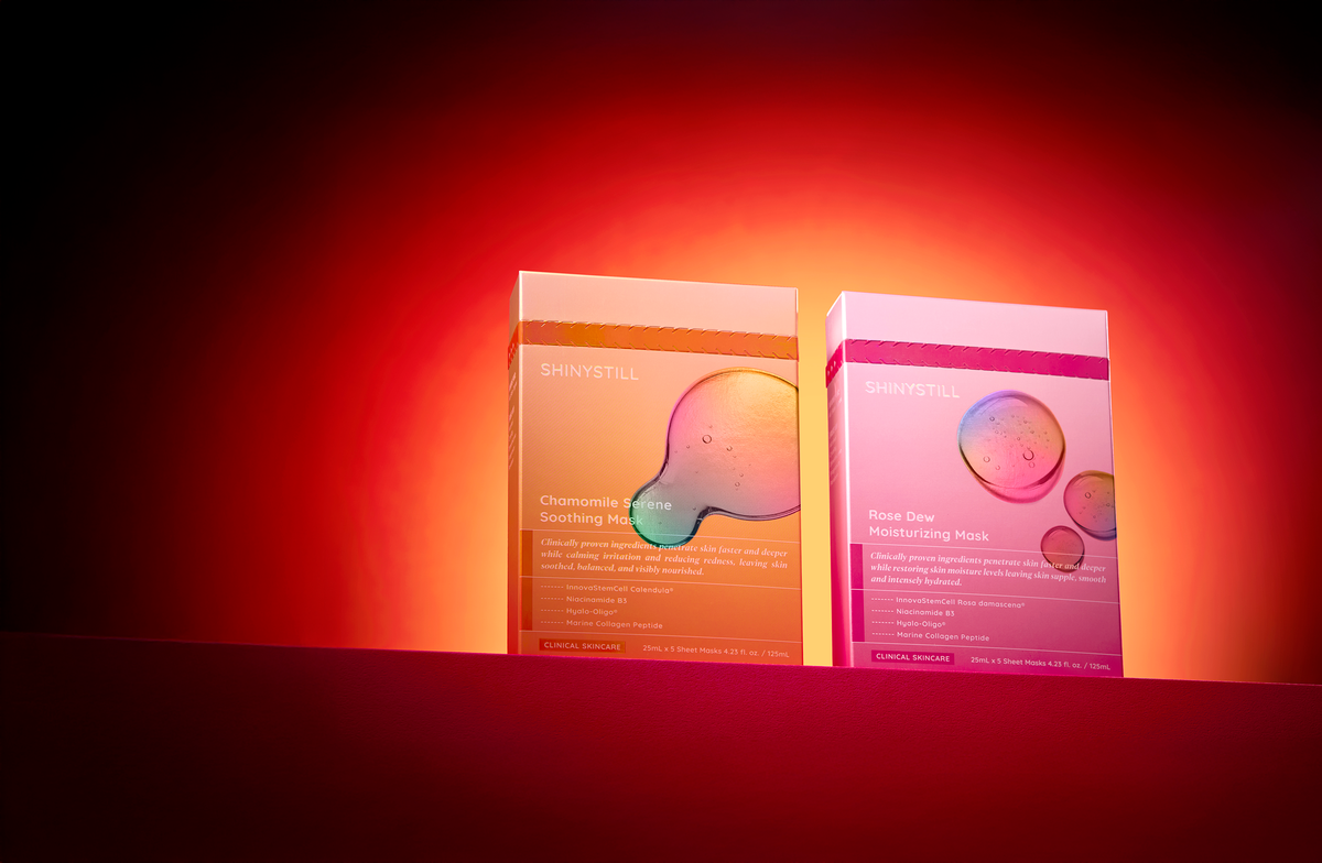Two skincare product boxes on a red background